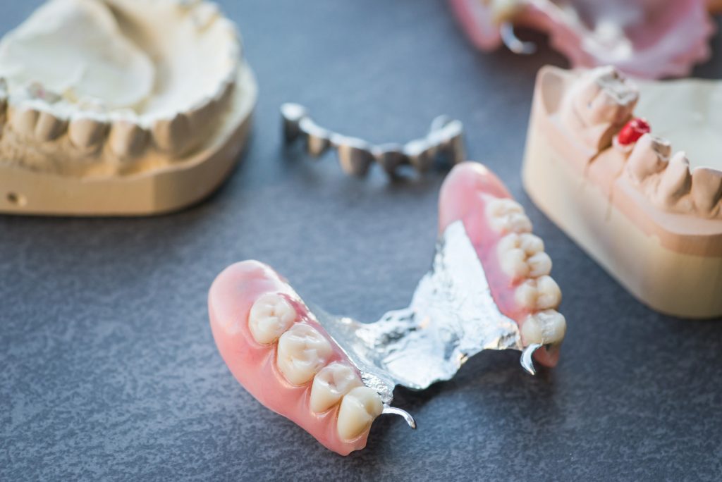 learn how to adjust your life with dentures comfortably